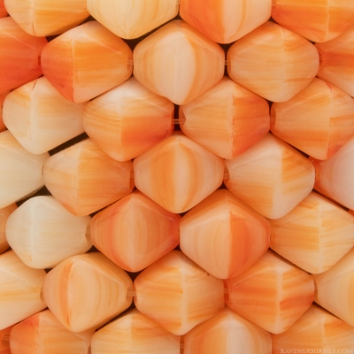 Bicone (6X6mm) Orange and White Ivory Mix